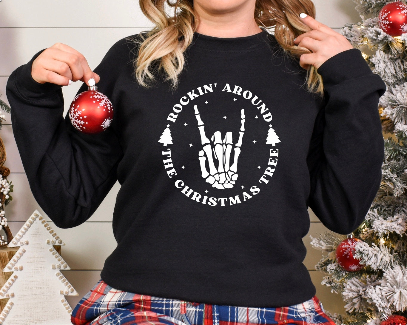 Rockin around the Christmas tree skeleton hand unisex crewneck sweatshirt in black