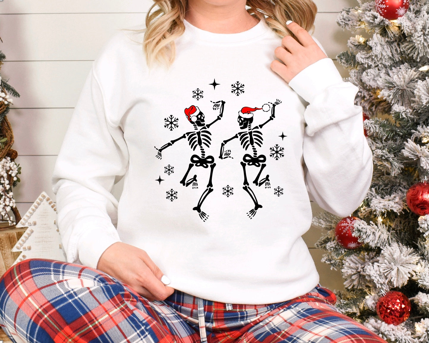 Dancing skeletons with Santa hats Christmas unisex crewneck sweatshirt in white
