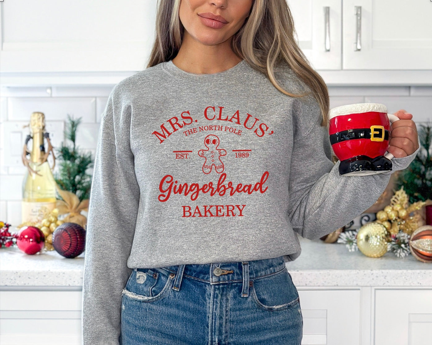 Mrs. Claus' gingerbread bakery unisex crewneck sweatshirt in grey with red graphic