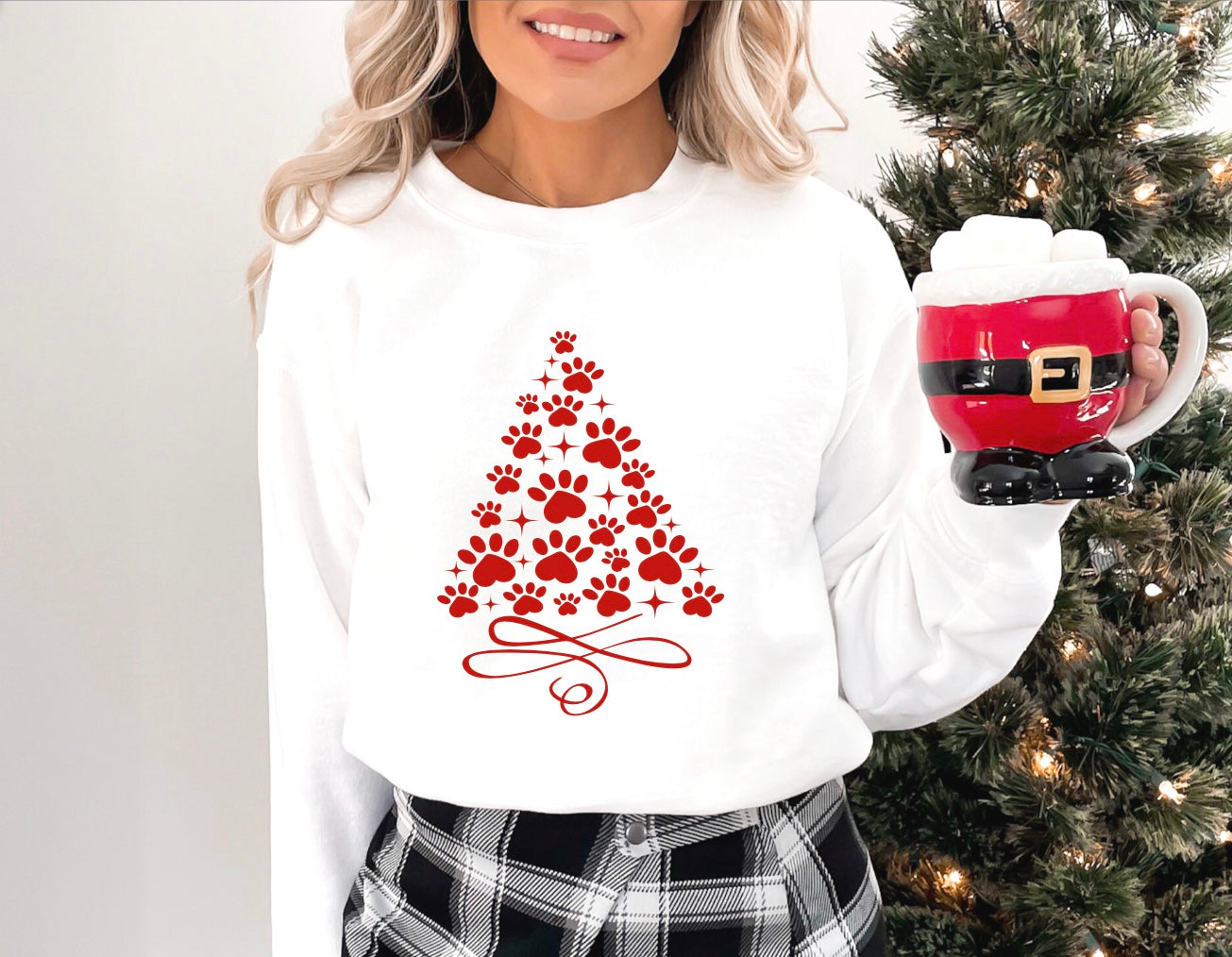 Paw print christmas tree graphic unisex crewneck sweatshirt in white with red graphic