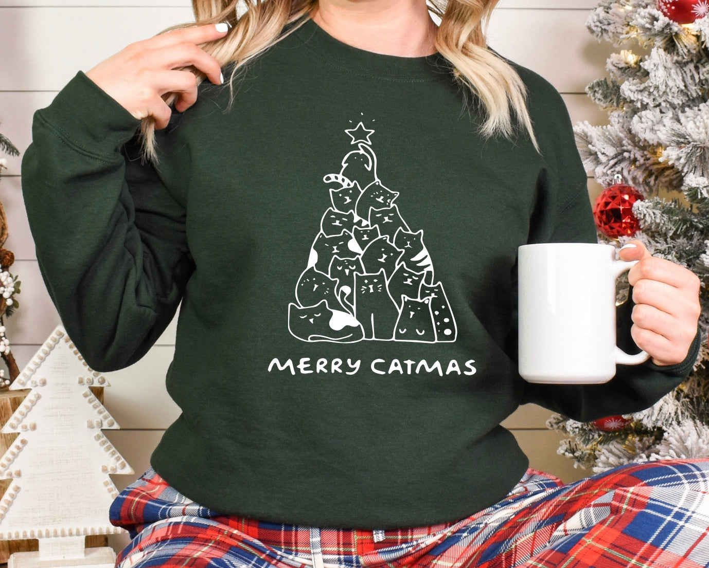 Merry Catmas unisex crewneck sweatshirt in green with white graphic