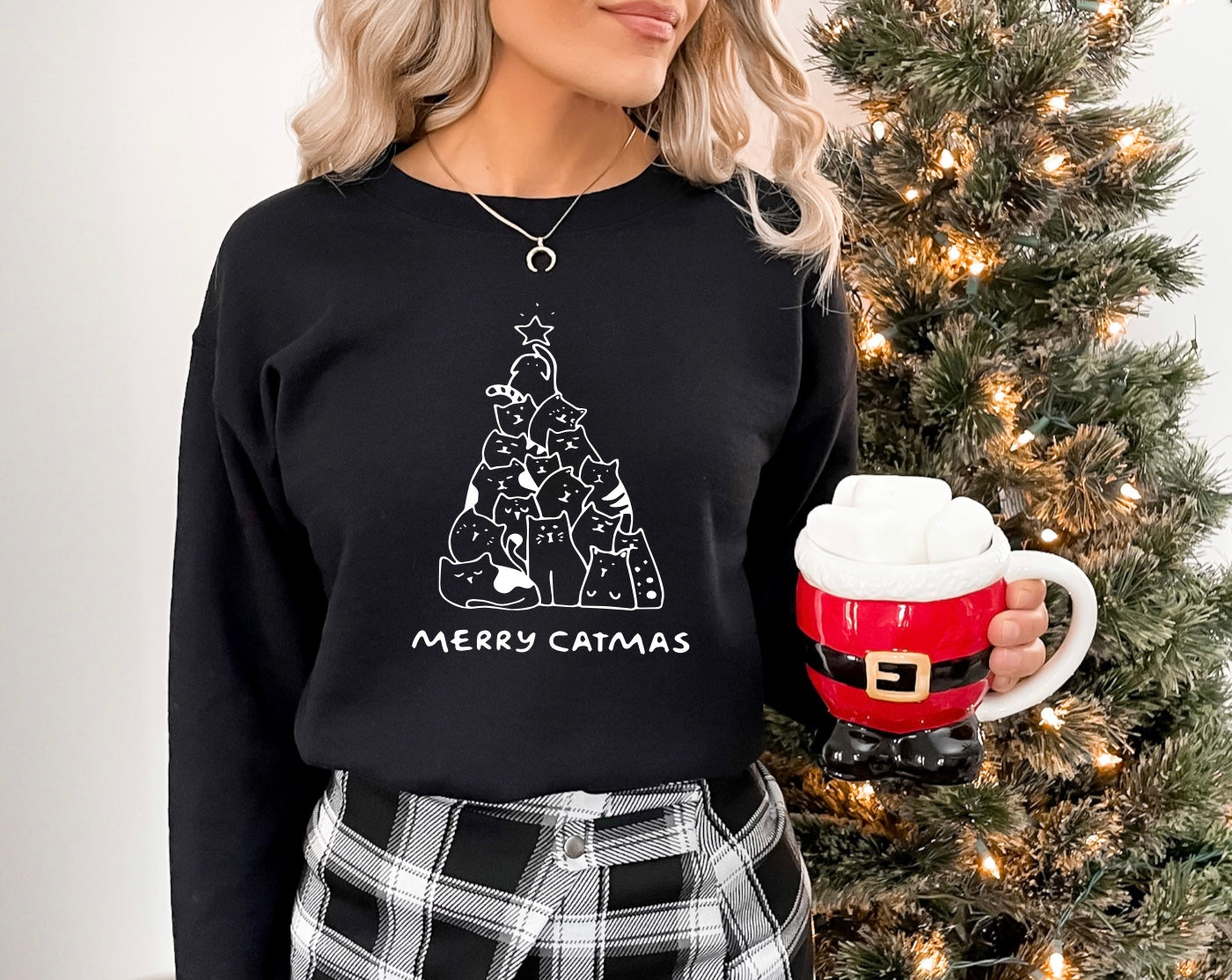 Merry Catmas unisex crewneck sweatshirt in black with white graphic
