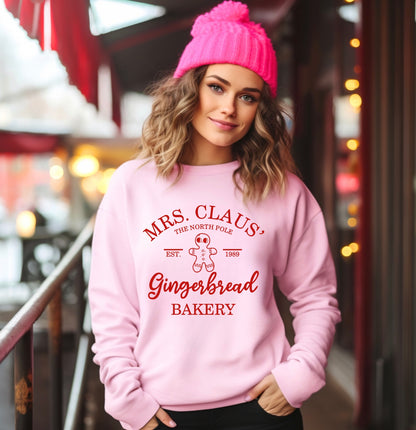 Mrs. Claus' gingerbread bakery unisex crewneck sweatshirt in pink