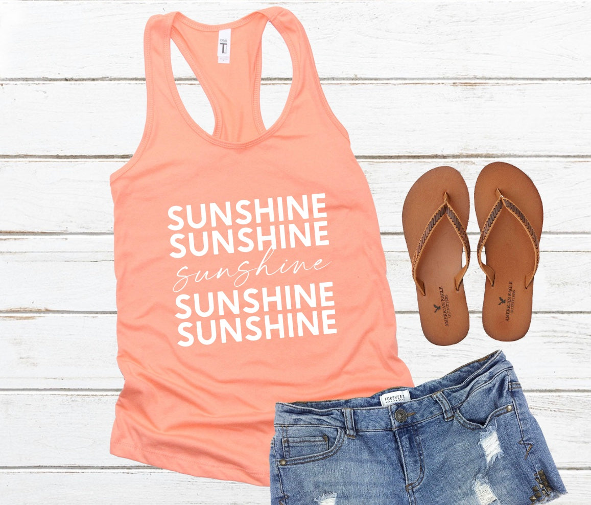 Sunshine repeating text racerback tank top in orange with white graphic