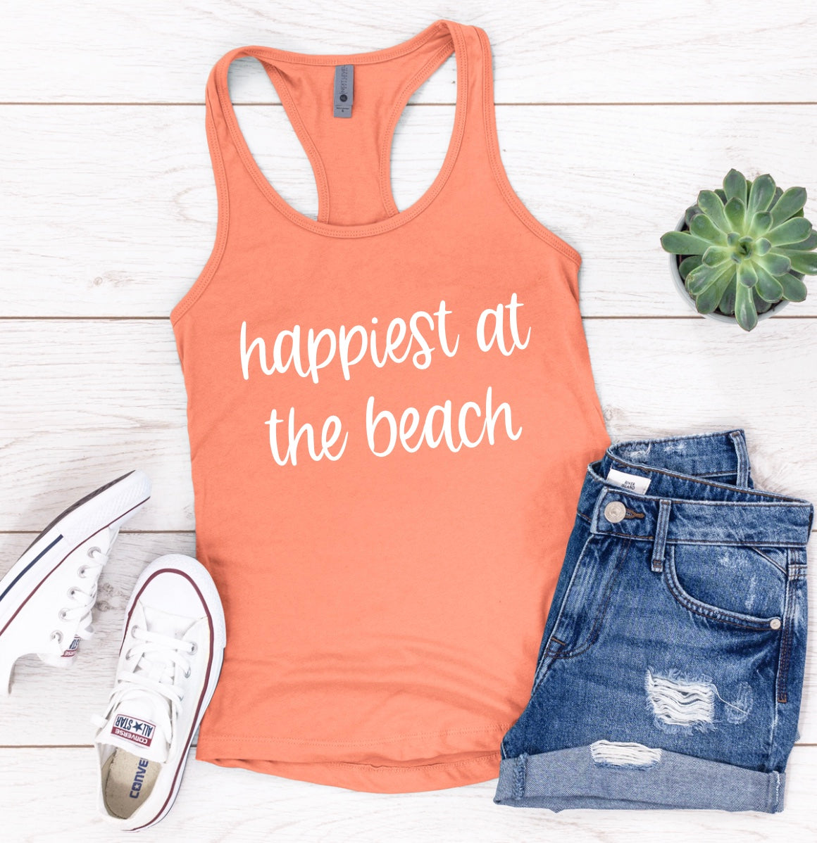 Happiest at the beach racerback tank top in orange with white graphic 