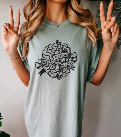 Your anxiety is a lying bitch comfort colors t-shirt with floral brain design in bay