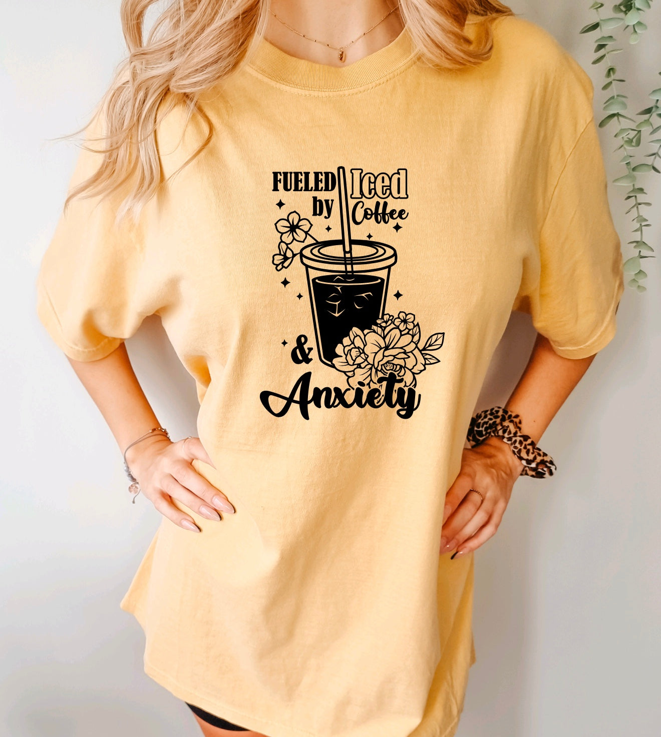 Fueled by iced coffee and anxiety comfort colors unisex t-shirt for women in mustard