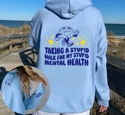 Taking a stupid walk for my stupid mental health unisex hoodie in blue with sleeve design
