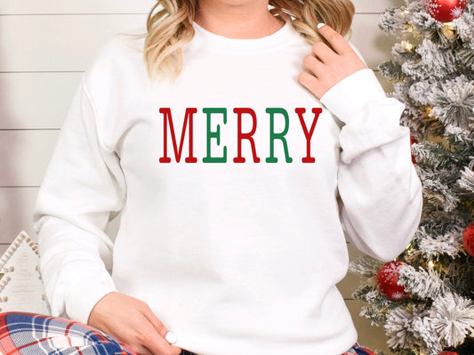 Merry red and green text on a white unisex crewneck sweatshirt 