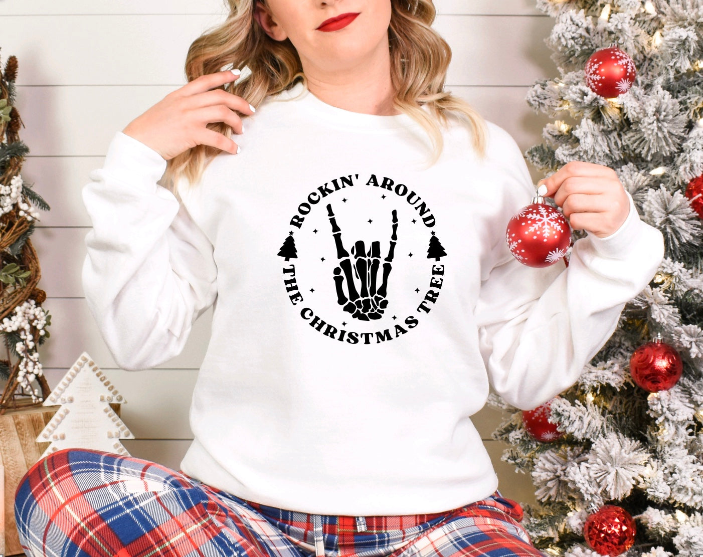 Rockin around the Christmas tree skeleton hand unisex crewneck sweatshirt in white 