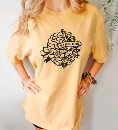 Your anxiety is a lying bitch comfort colors t-shirt with floral brain design in mustard
